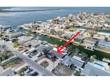 Waterfront neighborhood aerial shot featuring canal access, boat docks and proximity to open water at 13603 Jennita Dr, Hudson, FL 34667