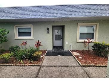 Inviting front entrance with well maintained landscaping and neutral color scheme at 3233 Teeside Dr, New Port Richey, FL 34655