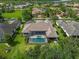 Aerial view of a house with pool and spa in a upscale community at 11826 River Shores Trl, Parrish, FL 34219