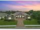 Luxury home with tile roof, landscaping and paved driveway at 11826 River Shores Trl, Parrish, FL 34219