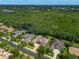 Aerial view of a neighborhood showcasing a house with preserve views at 11826 River Shores Trl, Parrish, FL 34219