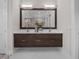 Bathroom with dark brown double vanity and white countertop at 11826 River Shores Trl, Parrish, FL 34219