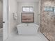 Elegant bathroom with free-standing tub and walk-in shower at 11826 River Shores Trl, Parrish, FL 34219