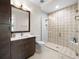 Modern bathroom with patterned shower tile and vanity at 11826 River Shores Trl, Parrish, FL 34219