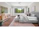 Primary bedroom with hardwood floors and large window at 11826 River Shores Trl, Parrish, FL 34219