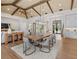 Elegant dining room with a large wooden table, high ceilings, and hardwood floors at 11826 River Shores Trl, Parrish, FL 34219