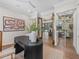 Bright home office with built-in shelving and a view into the living area at 11826 River Shores Trl, Parrish, FL 34219
