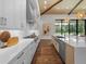 Modern kitchen features white cabinets, quartz countertops, and a stylish backsplash at 11826 River Shores Trl, Parrish, FL 34219