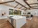 Gourmet kitchen boasts modern appliances, a large island, and high-end finishes at 11826 River Shores Trl, Parrish, FL 34219