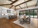 Open concept kitchen and dining area with large island, hardwood floors and pool view at 11826 River Shores Trl, Parrish, FL 34219