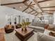 Spacious living room with vaulted ceiling, hardwood floors, and comfortable seating at 11826 River Shores Trl, Parrish, FL 34219