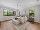 Spacious main bedroom with hardwood floors and large windows at 11826 River Shores Trl, Parrish, FL 34219