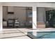 Outdoor kitchen, dining, and lounge area with pool view at 11826 River Shores Trl, Parrish, FL 34219