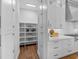 Walk-in pantry with ample shelving for storage at 11826 River Shores Trl, Parrish, FL 34219