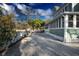Paver driveway leading up to a two-story home, showcasing its landscaped yard at 304 15Th W St, Bradenton, FL 34205