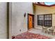 Exterior entryway with brick patio and small sitting area at 6016 Courtside Dr # 111, Bradenton, FL 34210
