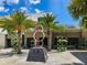 Outdoor plaza with sculpture, restaurants, and lush landscaping at 430 Kumquat Ct # 310, Sarasota, FL 34236