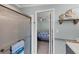 Bathroom with shower and view into bedroom at 1532 46Th Avenue E Dr, Ellenton, FL 34222
