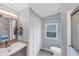 Clean bathroom with white shutters and modern vanity at 1532 46Th Avenue E Dr, Ellenton, FL 34222