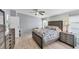 Spacious bedroom with wood-look floors and ceiling fan at 1532 46Th Avenue E Dr, Ellenton, FL 34222