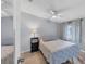 Cozy bedroom with light-colored bedding and small nightstand at 1532 46Th Avenue E Dr, Ellenton, FL 34222