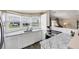 Modern kitchen with white cabinets and granite countertops at 1532 46Th Avenue E Dr, Ellenton, FL 34222