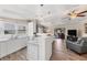 Open concept kitchen with island and living room view at 1532 46Th Avenue E Dr, Ellenton, FL 34222