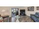 Living area with gray sofas and access to lanai at 1532 46Th Avenue E Dr, Ellenton, FL 34222