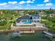 Luxury waterfront home with pool, dock, and stunning views at 443 Picasso Dr, Nokomis, FL 34275