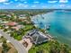 Waterfront home with private dock and lush tropical landscaping at 443 Picasso Dr, Nokomis, FL 34275