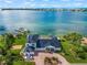 Spacious waterfront home with a large driveway and boat dock at 443 Picasso Dr, Nokomis, FL 34275