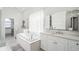 Elegant bathroom with soaking tub, double vanity, and separate shower at 443 Picasso Dr, Nokomis, FL 34275