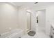 Clean bathroom with shower and tub, gray floor tile at 443 Picasso Dr, Nokomis, FL 34275