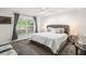 Spacious bedroom with plush bed, nightstands, and window at 443 Picasso Dr, Nokomis, FL 34275