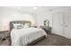 Comfortable bedroom featuring a king-size bed and vanity at 443 Picasso Dr, Nokomis, FL 34275