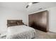 Comfortable bedroom with large dark brown closet and ceiling fan at 443 Picasso Dr, Nokomis, FL 34275