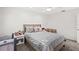 Charming bedroom with a queen bed, nightstand and crib at 443 Picasso Dr, Nokomis, FL 34275
