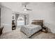 Spacious bedroom with a large window, ceiling fan, and ample closet space at 443 Picasso Dr, Nokomis, FL 34275