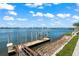 Wooden dock and lift offer easy boat access at 443 Picasso Dr, Nokomis, FL 34275