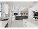 Open concept kitchen with island and living room views at 443 Picasso Dr, Nokomis, FL 34275