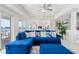 Comfortable living room with sectional sofa and water views at 443 Picasso Dr, Nokomis, FL 34275
