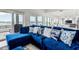Relaxing living room with sectional sofa and access to patio and water views at 443 Picasso Dr, Nokomis, FL 34275