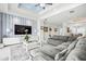 Living room boasts water views and a large sectional sofa at 443 Picasso Dr, Nokomis, FL 34275