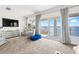 Main bedroom with stunning water views and plush seating at 443 Picasso Dr, Nokomis, FL 34275
