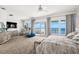 Spacious main bedroom with water views and sitting area at 443 Picasso Dr, Nokomis, FL 34275