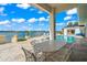 Elegant patio furniture overlooking the pool and waterfront at 443 Picasso Dr, Nokomis, FL 34275