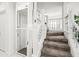 Modern staircase with a built-in elevator for convenient access at 443 Picasso Dr, Nokomis, FL 34275