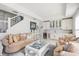 Elegant wet bar with white cabinets, wine cooler, and seating area at 443 Picasso Dr, Nokomis, FL 34275