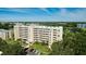 Aerial view of the building with a glimpse of the surrounding community and well-manicured landscaping at 4410 Fairways Blvd # 505, Bradenton, FL 34209