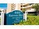 Welcoming community sign with lush landscaping, manicured lawn, and an exterior view of the building at 4410 Fairways Blvd # 505, Bradenton, FL 34209